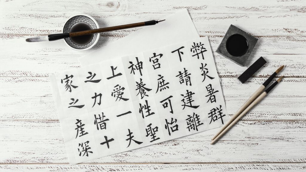 top-view-assortment-chinese-symbols-written-with-ink